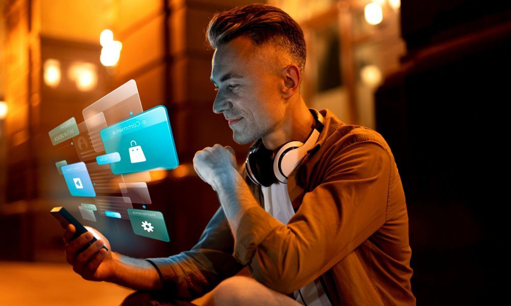 Man using a smartphone surrounded by floating SaaS application interface elements including e-commerce, web design, and marketplace icons
